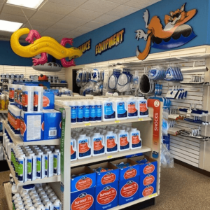 Shelf stocked with pool chemicals